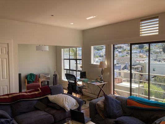 Living and dining room that is in the process of getting organized