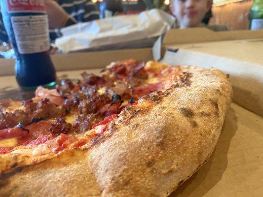 The pizza is great and I loved the crust. Evidently my son, in the background, approved too.