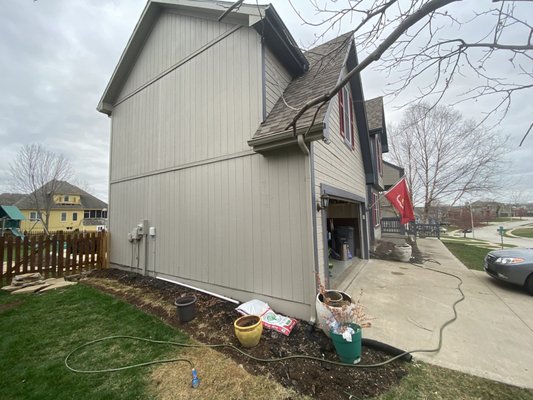 Left side of house (before).