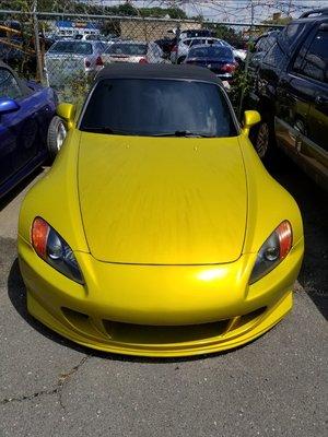 This picture shows the car being under the sun and very dirty