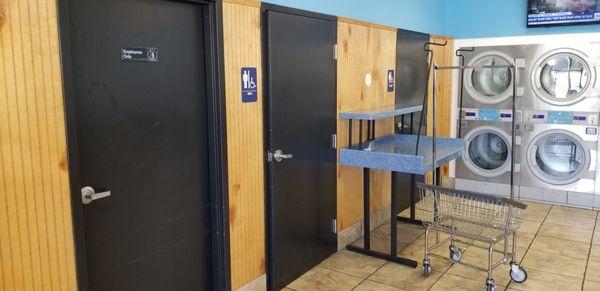 Clean bathrooms and several folding tables are available.