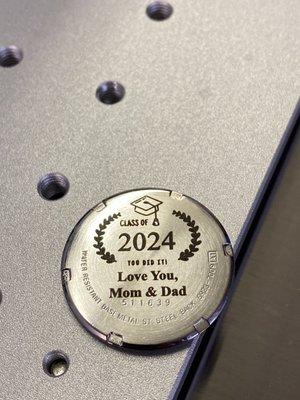 Example of laser marking on back of a watch.