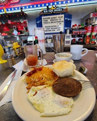 2 eggs, sausage patties (Big) hasbrowns and a biscuit. Large side of gravy too.