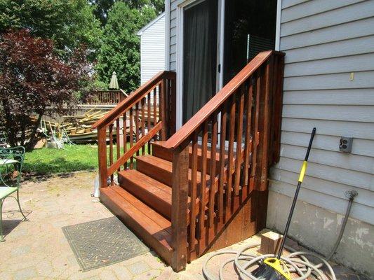 Redwood stained patio stairs side view