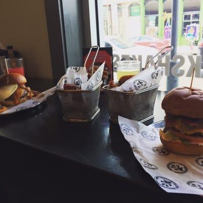 Elk burger with onion rings and the antelope burger with sweet potato tots