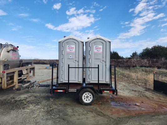 Dual Unit Trailer - Includes (2) Portable Toilets and (2) Hand Wash Stations. Ideal for construction sites and agriculture.