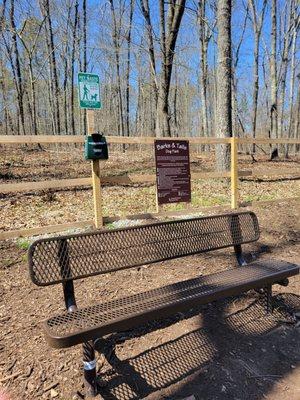 Benches and complimentary pet waste stations are provided.