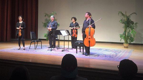 Judy Lin Vu, Zeljko Milicevic, Alycia Wilder, and Brandon Cota take their final bow after performing in the FIM’s MacArthur Recital Hall.