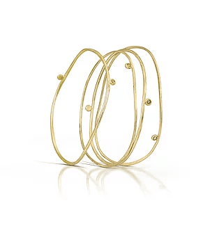 Flow River Bangles
 Crafted in 14K yellow gold and sprinkled with rose cut diamonds, our river bangles are as delicious as they are classic.