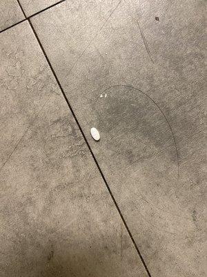 Pill on floor