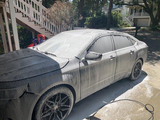 Car completely covered in foaming wash