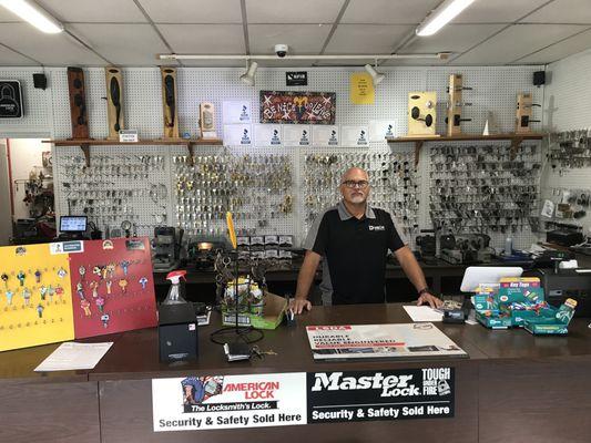 Owner & Operator of the Store & the Back Wall of the Store