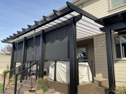 Patio cover with roll up solar screen