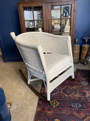 Restored and refinished wicker chair with custom cushion.