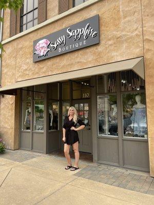 Tiffany standing outside their boutique!