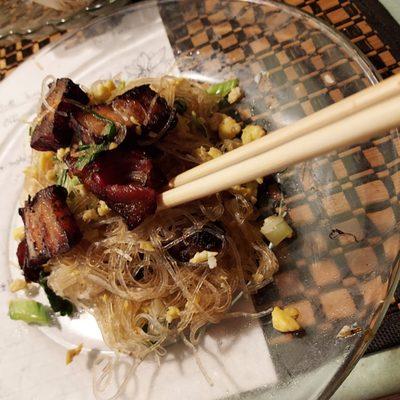 Smoked pork belly pancit.  Thin stir fried noodles with egg and green onion.