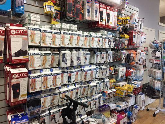 A wall of "leg health" stockings and a few braces and stabilizers