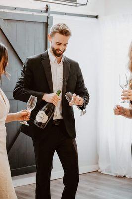 Bride & Groom Champagne Toast at Fly the Coop Studio in Coeur d'Alene, ID - Photos by Film Moods