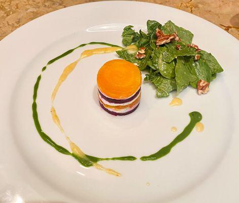 Roasted beet napoleon with goat cheese, baby spinach salad with toasted pecans and an orange sherry vinaigrette, basil oil drizzle