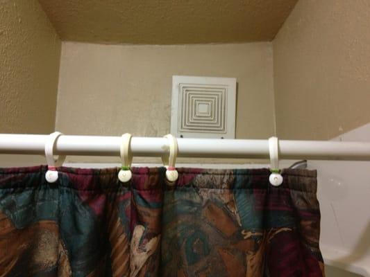 Vent falling out of the wall and some rubber-band mcgyvering to keep the shower curtains in place