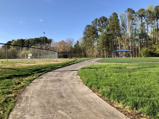 Picnic area and walkway recently placed beyond the outfield of the baseball field.