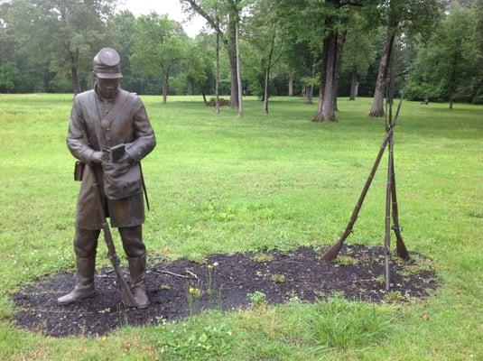 Life-like bronze figures depicting their daily life. Men were used as guards for the camp.