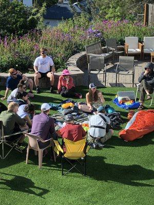 Danielle teaching With The Wild Things Ultralight 101 and helping students go through their backpacking gear