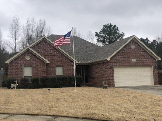 New weathered wood shingle roof bought and paid for by the homeowners insurance in Cabot, AR