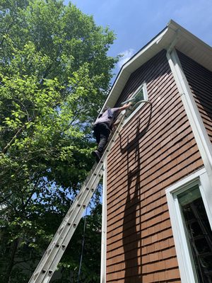 Cleaning second floor exterior casement crank out  window