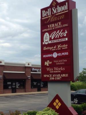 Sign and front door of Hearing Helpers across from Golf Shack and Garrett's