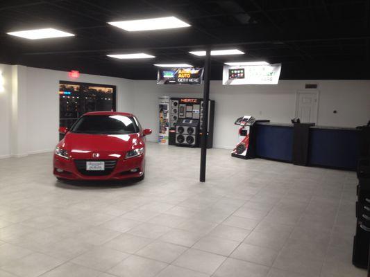 Test fitting for a demo car on showroom floor.