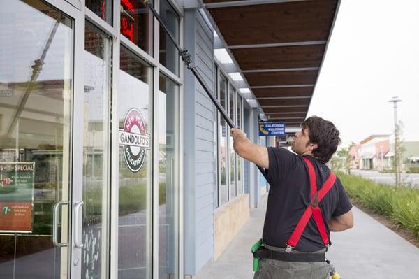 Using a high-tech window cleaning tool! The Window Guys are very detail oriented and always make sure their customers are happy!