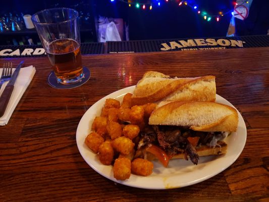 Cheesesteak and tots, cold local beer!