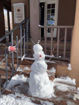 Snowman with coffee cup