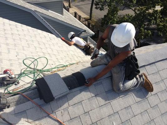 Hip and Ridge shingles being installed