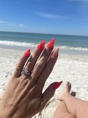 My latest, fiery-coral nails