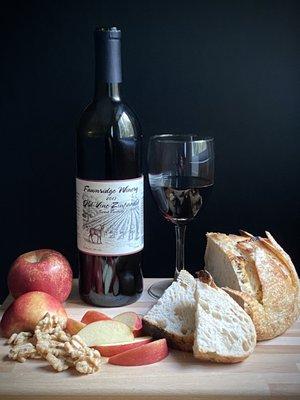 Keep it simple. Wine, apples, nuts, and fresh baked bread.