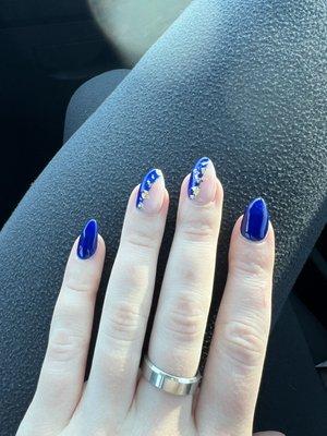 Blue acrylic nails with gold flakes