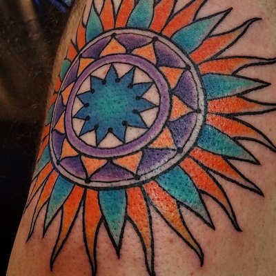 Nicole specializes in bold, bright color tattoos.