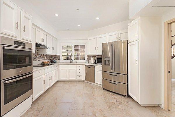 We had the seller paint out these chocolate brown cabinets to Matt white! Wow!