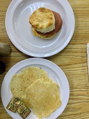 Fried bologna, egg, and cheese of biscuit. 2 pancakes.