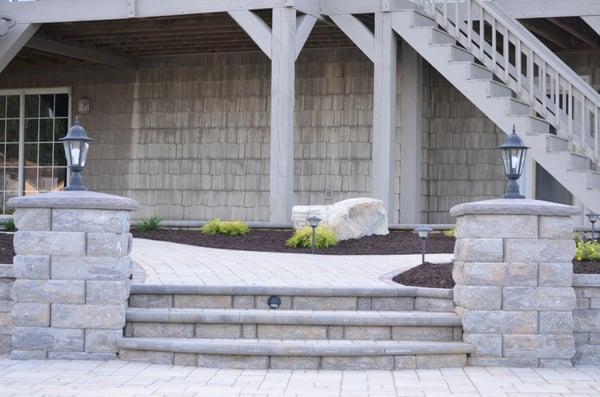 K & T built stairs with columns from the main patio to the sidewalk.  Both the stairs and the columns have lights installed.