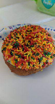 Frosted cake donut with sprinkles