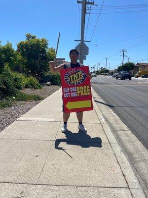 Youth member #2 holding up send to promote