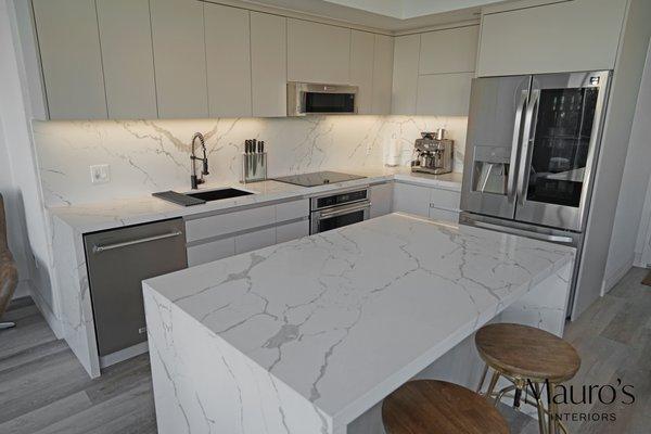 This kitchen is full of technology, from its soft close drawers, to hinges that allow some of the doors to open vertically.