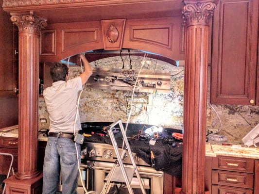 John installing under the counter lights powered and control by an over the range vent hood.