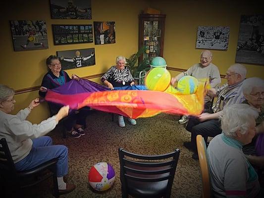 Parachutes get elders active and enjoying some fun together.