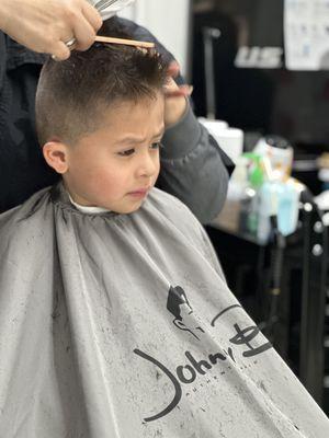 My son getting his hair cut by Nallely.