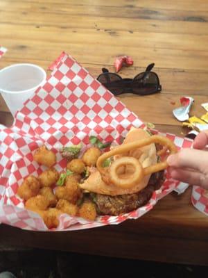 Burger with tots and a rather special onion ring