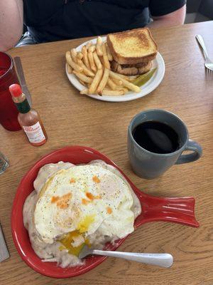 Nashville chicken sandwich and full order of biscuits n gravy with 2 eggs over easy and a splash of Tabasco. Black coffee.